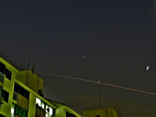 2-minute exposure with Canon SX50 shows streaks from airplane and stars