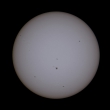 Original size composite of the ISS transiting the Sun